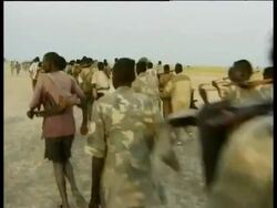 Group of soldiers marching, following oil exploitation, Nhialdiu, Western Upper Nile, Sudan Stock Footage