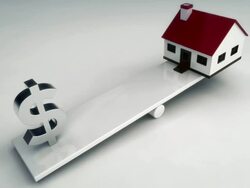 Dollar sign and house on see saw Stock Footage