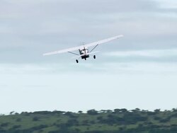 WS AERIAL TS View of Light aircraft flying over with forest / iSimangaliso Wetland Park, Kwazulu Natal, South Africa Stock Footage