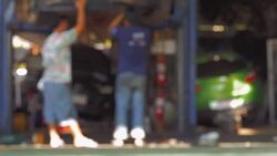 Mechanic working in auto repair garage. Car maintenance. Stock Footage