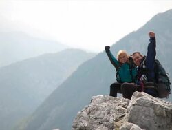 HD: Couple On A Mountain Peak Stock Footage