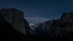 Stars and moonlight move in the night sky over Yosemite National Park in California. Stock Footage