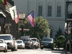 Medium Shot - Car drives down narrow side street / New Orleans Louisiana Stock Footage