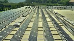 AERIAL Solar Panels On An Industrial Building Stock Footage