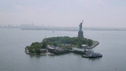 'WS AERIAL ZO View of Statue of Liberty and  n reveal for lower Manhattan / New York City, United States' Stock Footage