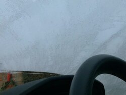 Scraping ice from car windshield Stock Footage