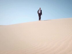 Businesswoman in desert Stock Footage