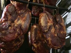 MS Shot of ham at smokehouse in butchery / Freudenburg, Rhineland Palatinate, Germany Stock Footage