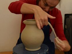 MS TD Shot of female potter makes handle to pitcher / Landshut, Bavaria, Germany Stock Footage