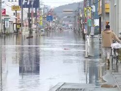 Destruction caused by tsunami after magnitude 9 Tohoku earthquake, north east Japan, March 2011. Sea water floods downtown Ishinomaki, Miyagi Prefecture at high tide after tsunami Stock Footage