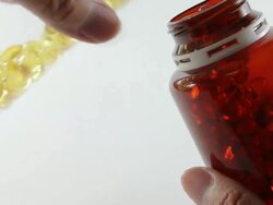 Pills pouring to fill the bottle Stock Footage