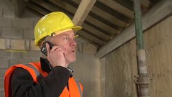 Builder on the Phone on Construction / Building Site Stock Footage