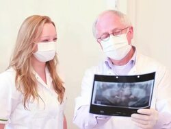 Assistant and dental himself checking the xray image. Stock Footage