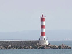 MS AERIAL TS TU Shot of Lighthouse at Port La Nouvelle / Languedoc Roussillon, France Stock Footage