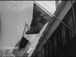 1951: HARVARD UNIVERSITY: TU WS Ve-ri-tas (truth) flag on building, MS Statue of John Harvard, XWS Iconic Charles River & bridge w/ buildings & Dunster House Tower (& clock) BG.  Iconic, Ivy League, private, higher education, privilege. Instructional Video