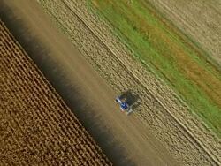 AERIAL Tractor Sowing The Field Stock Footage