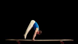 SLO MO Gymnast doing L-sit and hand stand Stock Footage