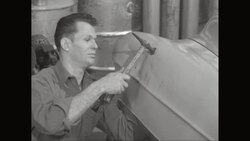 CU Man working on dent in car at repair garage / United States Stock Footage