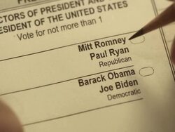 XCU of voter using pencil to mark presidential ballot for Barack Obama Stock Footage