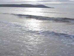 Flight over winter waves at beach Stock Footage