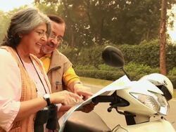 Senior couple watching map, Delhi, India Stock Footage
