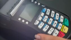 Woman making payment with credit card and entering PIN code Stock Footage