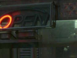 A food vendor has a blinking OPEN sign in his window, he works in the background Stock Footage