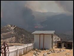 A deadly wildfire that has blackened a wide swath of tinder-dry forest around Los Angeles made another menacing advance Monday, surging toward thousands of suburban homes, as the AP's John Mone reports. News Clip