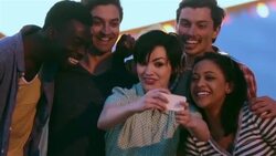 Group of friends take smartphone photo under classic Welcome To Las Vegas sign Stock Footage