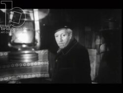 Old man leads child to his house and they prepare dinner. France, 1960 Stock Footage