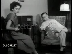 1950: U.S. LISTENING TO TRUMAN: CU Radio dial. VS Couple listening to radio, U.S. President Harry S. Truman VO '... cost of freedom is high, but we are determined to preserve our freedom no matter what the cost.' Korean War Instructional Video