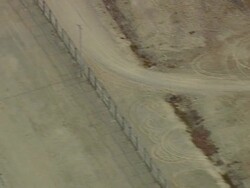 WS ARIEAL View of Compound with wooded area and fields / Maine, United States Stock Footage