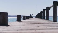 Surface level view of dock at waterfront Stock Footage