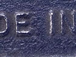 "MADE IN U.S.A" shown in raised lettering on metal surface. Stock Footage