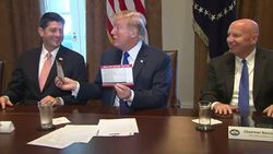Trump seals Republicans' tax plan with a kiss News Clip