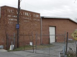 Peeling Sign on the Side of a Closed Factory Stock Footage