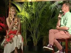 Elizabeth Banks on Woody Harrelson in Hunger Games Stock Footage