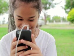 Girl having a video chat on smartphone,Dolly shot Stock Footage