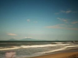 WS T/L View of White clouds and wave crests dance in sunlit blue sea sky scape with distant islands / Hoi An, Vietnam Stock Footage