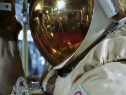 Space suit with gold coated visor Stock Footage