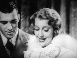 B/W 1939 close up Jeanette MacDonald talking as Ed Sullivan looks on in background / newsreel Stock Footage