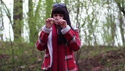 Chuff long brown haired girl breaks a cigarette into peaces Stock Footage
