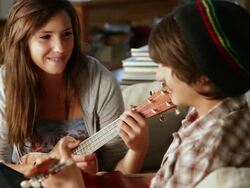 MS Two teenagers learning to play ukulele together / Lamy, New Mexico, United States Stock Footage