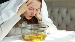 girl breathes vapors herbal decoction Stock Footage