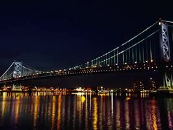 Night time, time lapse of Philadelphia cityscape, with Delaware River and Ben Franklin Bridge in foreground. Stock Footage