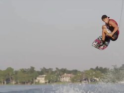USA, Florida, Orlando, Maitland Lake. Young man on wakeboard Stock Footage