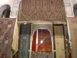 MS TD Shot of hand made rugs inside of building in city / Fes, Centro-North, Morocco Stock Footage