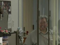 2009 MS Woman receiving paperwork from clerk at counter, new applicant walking towards counter/ Antioch, California, USA/ AUDIO Stock Footage