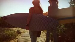Surfer girls let's go Stock Footage