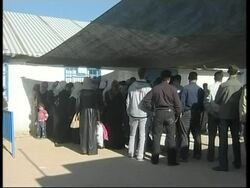 UN aid workers distribute food supplies to Gaza residents Instructional Video
